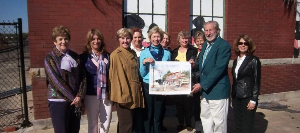 Mansfield presents a commemorative print to Paula Lindsay, President of the New Bern Woman’s Club