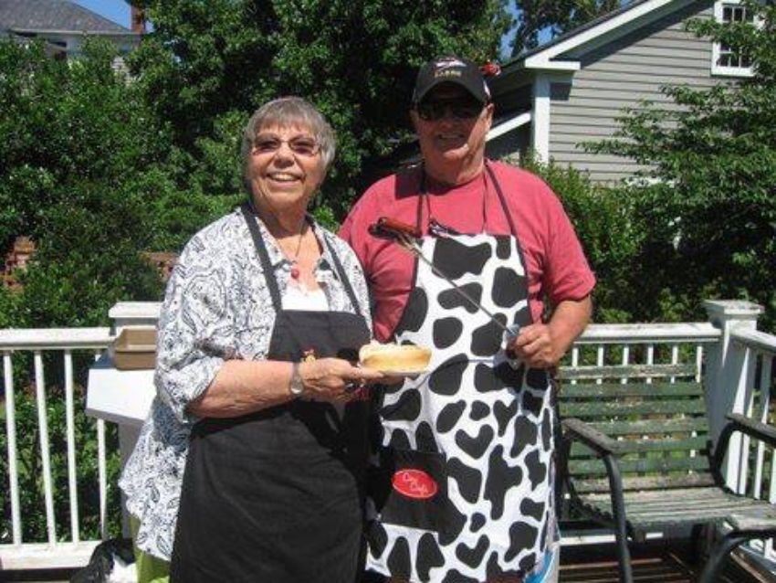 Buzz and Bette Mead holding hotdogs