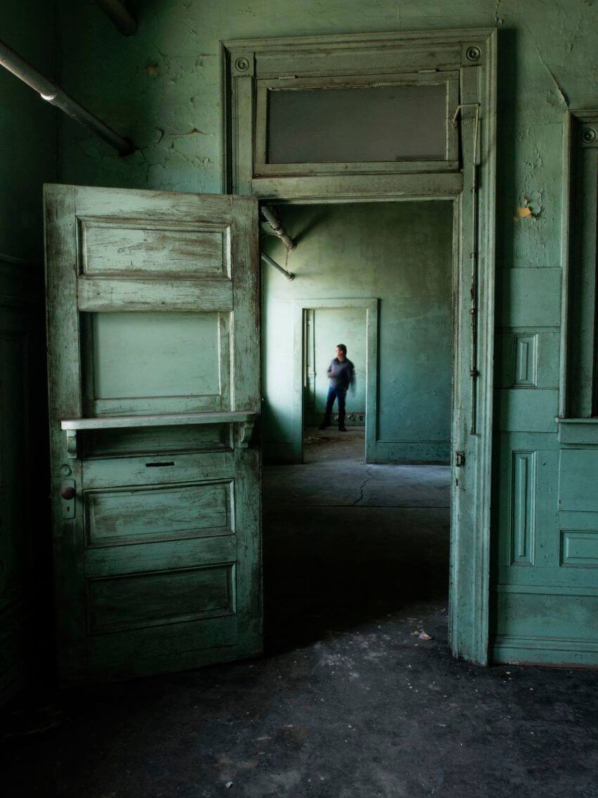 Old peeling paint on doorway and room