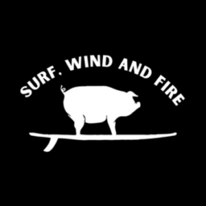 Words Surf, Wind and Fire in white and white pig on a surfboard on black background