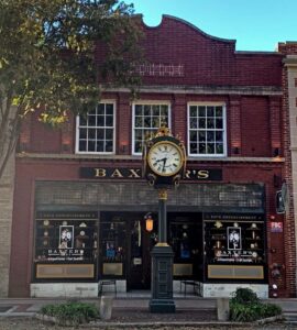 Historic two-story brick building with old clock