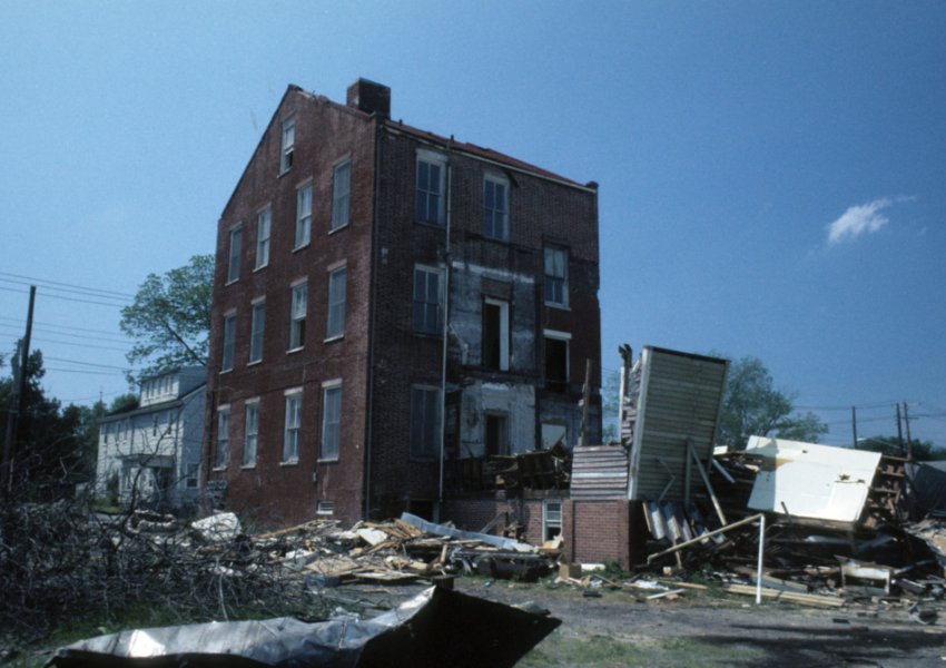 Old photo of 3 story derelict building