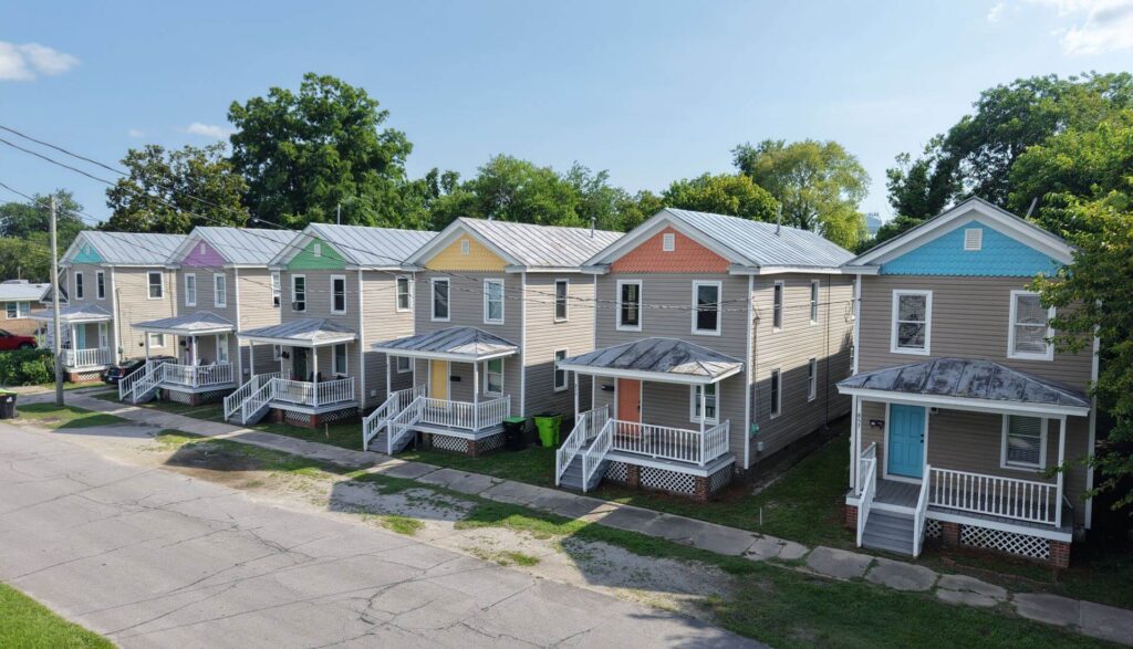 Drone photo of 6 identical two-story cottage home